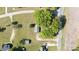 An aerial view of a charming cottage surrounded by lush greenery and trees on a spacious lot at 3842 Harmony Rd, Catawba, SC 29704