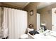 Functional bathroom includes a shower with curtain and a clean, well-lit vanity area at 3842 Harmony Rd, Catawba, SC 29704