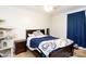 Bedroom featuring a dark frame bed, matching nightstand, and a cozy atmosphere at 3842 Harmony Rd, Catawba, SC 29704