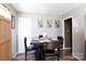 Cozy dining area featuring a wooden table set, matching chairs, and modern light fixtures at 3842 Harmony Rd, Catawba, SC 29704