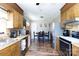 Functional kitchen area featuring classic cabinetry, stainless steel appliances, and an eat-in dining area at 3842 Harmony Rd, Catawba, SC 29704