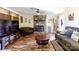 Spacious living room with a fireplace, wood floors, and cozy seating arrangements at 3842 Harmony Rd, Catawba, SC 29704