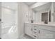Bright bathroom featuring a double vanity, and a shower/tub combo at 404 Balboa St, Matthews, NC 28104