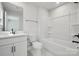 White bathroom with large vanity, toilet, and shower/tub combo at 404 Balboa St, Matthews, NC 28104