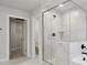 Modern bathroom featuring a glass shower with marble tile and a peek into the water closet at 404 Balboa St, Matthews, NC 28104