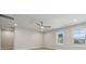 Bedroom with neutral paint, ceiling fan, hardwood floors, and natural light from the windows at 404 Balboa St, Matthews, NC 28104