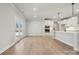 Bright kitchen with white cabinets, stainless steel appliances, and a view of the outdoor area at 404 Balboa St, Matthews, NC 28104