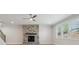 Inviting living room with a stone fireplace, hardwood floors, and a large window, providing natural light at 404 Balboa St, Matthews, NC 28104