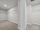 Spacious walk-in closet with shelving for optimal storage at 404 Balboa St, Matthews, NC 28104