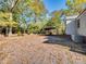 The exterior shows a carport structure near the house and mature shade trees in the yard at 412 Keels Ave, Rock Hill, SC 29730