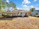 The backyard shows the house, a carport, a shed, and some shade trees at 412 Keels Ave, Rock Hill, SC 29730