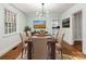 Classic dining room with hardwood floors, neutral colors, and modern chandelier at 412 Keels Ave, Rock Hill, SC 29730