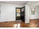 Hardwood floors in the home's entrance with black front door and lots of natural light at 412 Keels Ave, Rock Hill, SC 29730