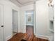 Bright hallway with hardwood floors and white trim leading to an adjacent room at 412 Keels Ave, Rock Hill, SC 29730