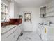 Well-lit kitchen featuring white appliances, white cabinets, and plenty of counter space at 412 Keels Ave, Rock Hill, SC 29730