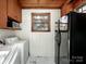 Laundry room features a side-by-side washer/dryer, black refrigerator, and window at 412 Keels Ave, Rock Hill, SC 29730