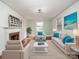 Bright living room features hardwood floors, neutral furniture, and decorative fireplace at 412 Keels Ave, Rock Hill, SC 29730