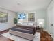 Main bedroom featuring two windows, hardwood floors, and a neutral color palette at 412 Keels Ave, Rock Hill, SC 29730