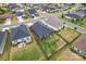 Aerial view of homes in a neighborhood with fenced in yards and a meticulously maintained lawn at 4171 Canopy Creek Dr, Denver, NC 28037