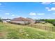 A sloped grassy backyard with a black metal fence at 4171 Canopy Creek Dr, Denver, NC 28037