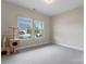 Bright bedroom with carpet, two windows with blinds, neutral paint, and a cat tower at 4171 Canopy Creek Dr, Denver, NC 28037