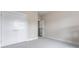 Empty bedroom with carpet, neutral paint, a closet, and a baby gate blocking the doorway at 4171 Canopy Creek Dr, Denver, NC 28037
