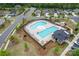Aerial view of a community pool with a lazy river, lap pool, and lounge area, surrounded by landscaping at 4171 Canopy Creek Dr, Denver, NC 28037