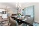 View of dining room open to living room with seating for six and an orchid centerpiece at 4171 Canopy Creek Dr, Denver, NC 28037