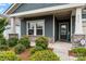 Charming home entrance with stone accents, complemented by green bushes at 4171 Canopy Creek Dr, Denver, NC 28037