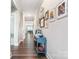 Inviting hallway featuring hardwood floors and tasteful decor at 4171 Canopy Creek Dr, Denver, NC 28037