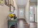 Inviting hallway featuring hardwood floors and tasteful decor at 4171 Canopy Creek Dr, Denver, NC 28037