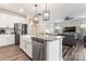 Modern kitchen with granite countertops, farmhouse sink, and stainless steel appliances at 4171 Canopy Creek Dr, Denver, NC 28037