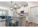 Stylish kitchen featuring white cabinets, granite countertops, and stainless steel appliances at 4171 Canopy Creek Dr, Denver, NC 28037
