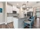 Stylish kitchen featuring white cabinets, granite countertops, and stainless steel appliances at 4171 Canopy Creek Dr, Denver, NC 28037