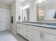 Main bathroom with double sinks, granite counters, white cabinets, and modern fixtures at 4171 Canopy Creek Dr, Denver, NC 28037