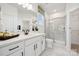 Modern bathroom with marble floors, a glass-enclosed shower, and sleek, dark hardware accents at 424 Balboa St, Matthews, NC 28104