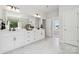 Bright bathroom features a double vanity, large mirror, and elegant lighting in this contemporary home at 424 Balboa St, Matthews, NC 28104