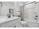 Clean bathroom with a white vanity, tub-shower, and modern fixtures, and light colored walls at 424 Balboa St, Matthews, NC 28104