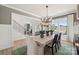 Inviting dining room with a modern table setting, stylish chairs, and large windows overlooking the outdoors at 424 Balboa St, Matthews, NC 28104