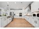Elegant kitchen with stainless steel appliances, farmhouse sink, and ample cabinet space at 424 Balboa St, Matthews, NC 28104