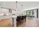Bright, modern kitchen with a center island and pendant lighting open to the dining area at 424 Balboa St, Matthews, NC 28104