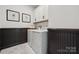 A crisp laundry room features modern appliances, ample storage, and stylish decor for chores at 424 Balboa St, Matthews, NC 28104