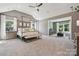 A spacious primary bedroom features a vaulted ceiling, large windows, and an attached sitting area at 424 Balboa St, Matthews, NC 28104