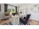 Bright home office with a large desk, comfortable seating, and stylish black and white patterned accents at 424 Balboa St, Matthews, NC 28104