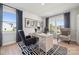 Stylish home office with modern décor, patterned rug, and large windows allowing for natural light and views at 424 Balboa St, Matthews, NC 28104