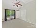 Bright bedroom with vaulted ceiling, large window, and spacious closet at 4301 Middle Stream Rd, Charlotte, NC 28213
