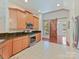 Well-equipped kitchen with stainless appliances, granite countertops, and a stylish barn door at 4301 Middle Stream Rd, Charlotte, NC 28213