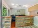 Spacious living room with a bar area and plenty of natural light at 4301 Middle Stream Rd, Charlotte, NC 28213