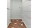 Spacious walk-in closet with built-in shelving and stylish flooring at 4301 Middle Stream Rd, Charlotte, NC 28213