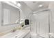 Clean bathroom featuring a sink with granite countertops, a toilet, and a shower with sliding doors at 4360 Woodglen Ln, Charlotte, NC 28226